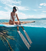 High-quality freediving gear for women, including wetsuits, fins, and masks.